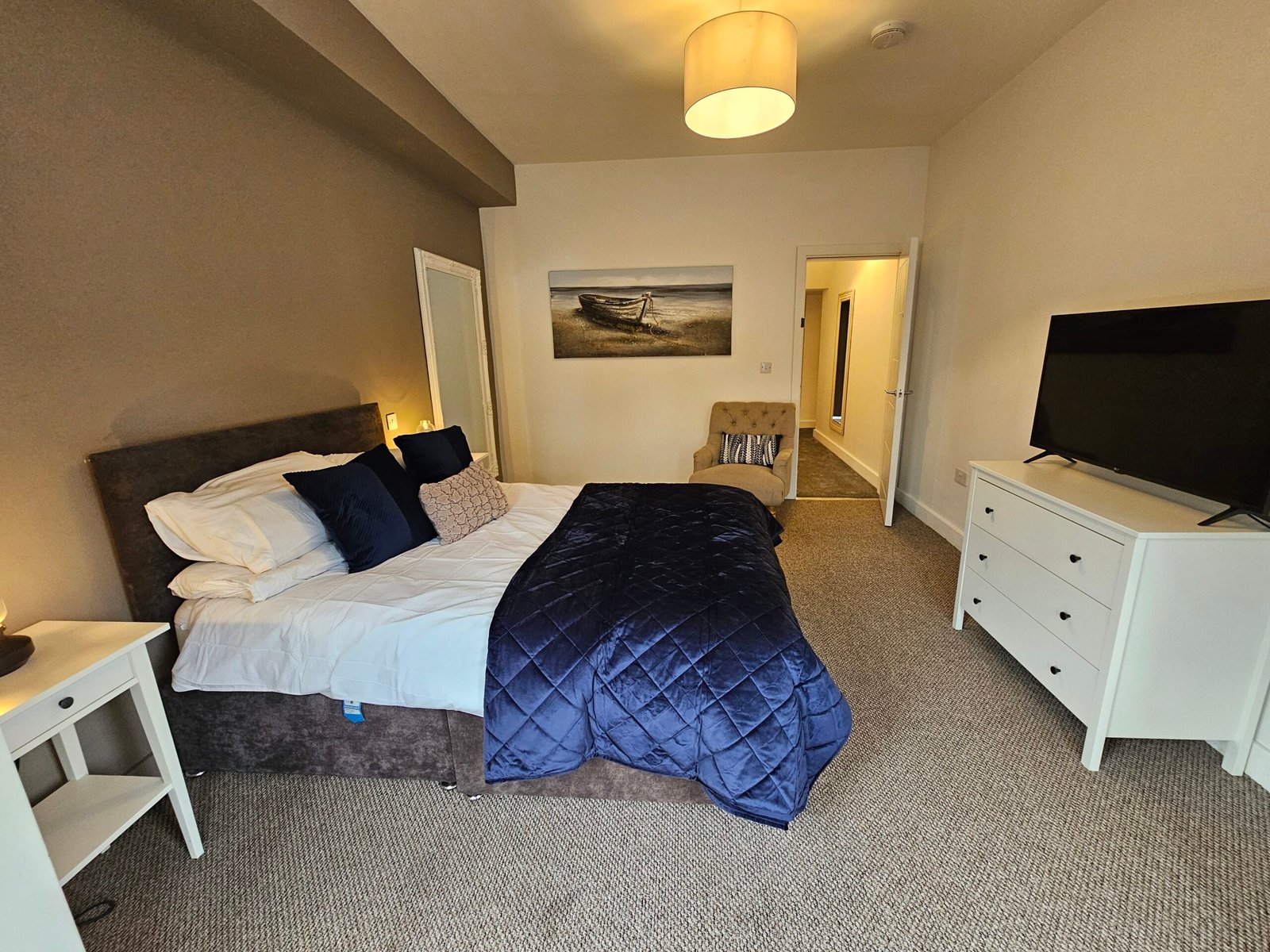 Double bedroom with blue bedding at Kings Central Apartment